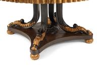 A Continental Polychrome Marquetry and Parcel Gilt Center Table