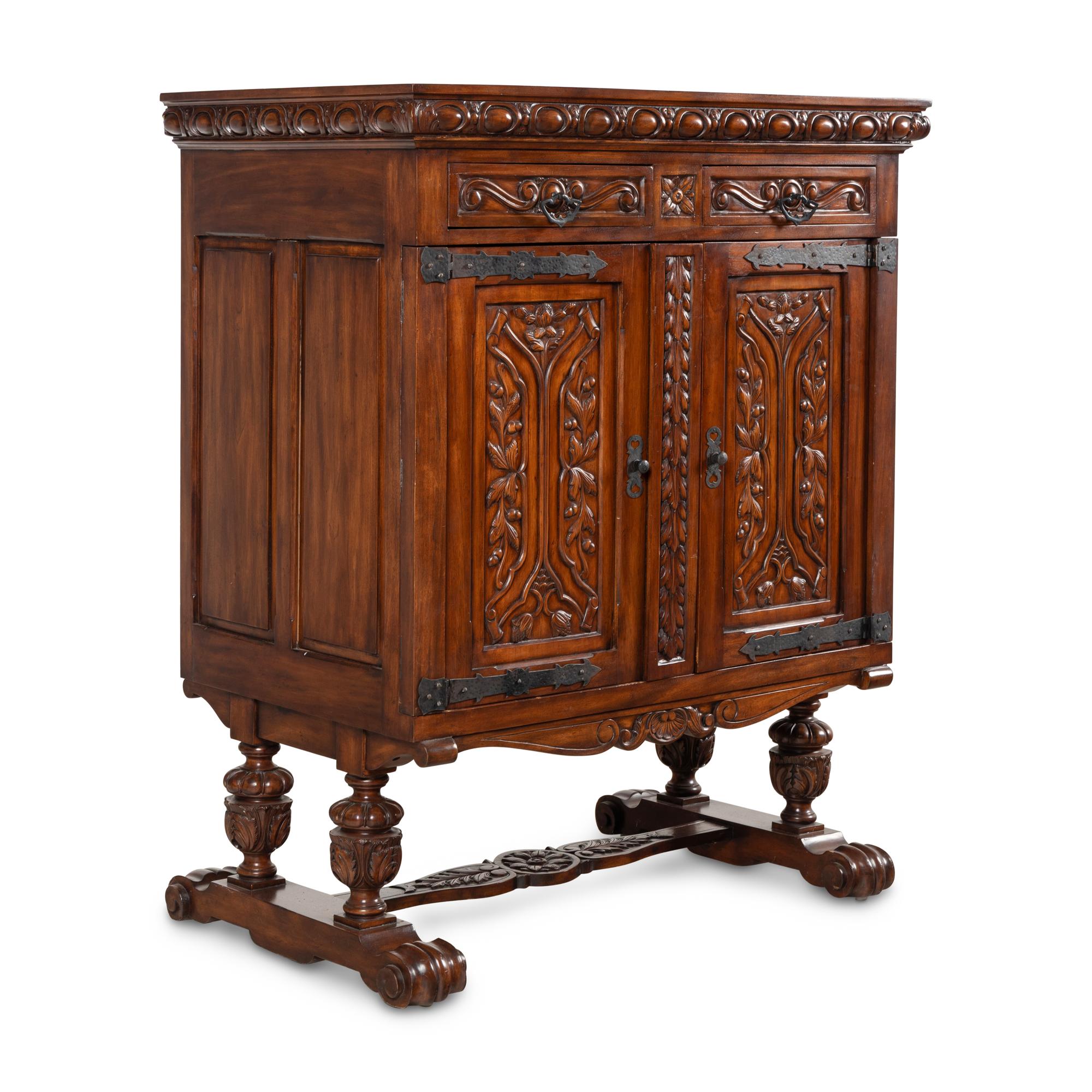 A Baroque Style Carved Walnut and Steel Mounted Cabinet