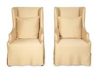 A Pair of Linen-Upholstered Wingback Slip Covered Chairs