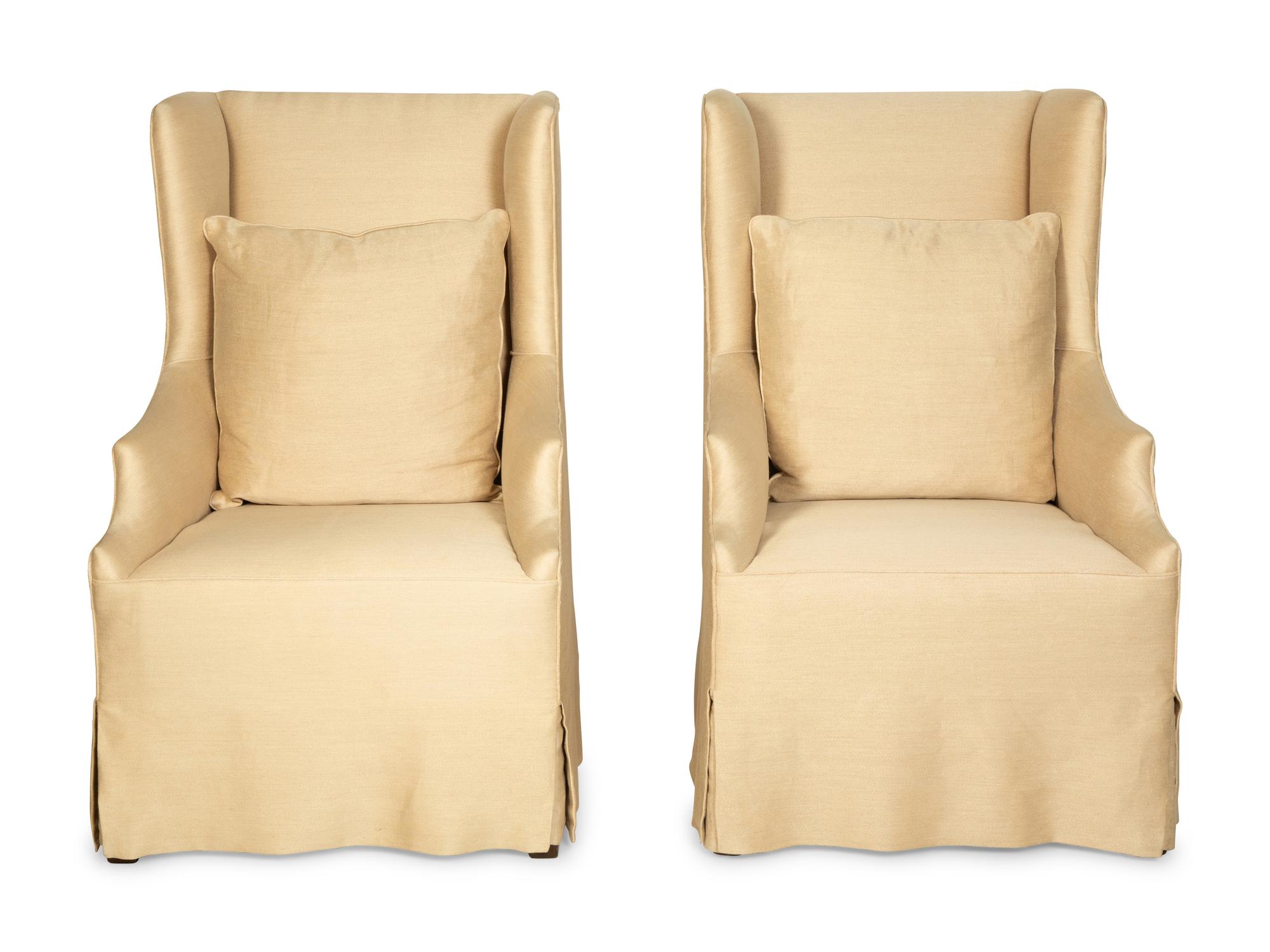 A Pair of Linen-Upholstered Wingback Slip Covered Chairs
