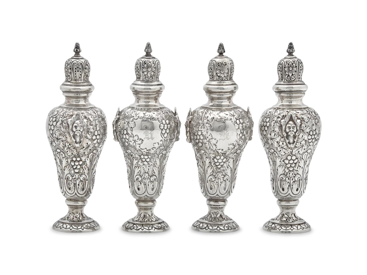 A Set of Four George V Silver Repoussé Casters