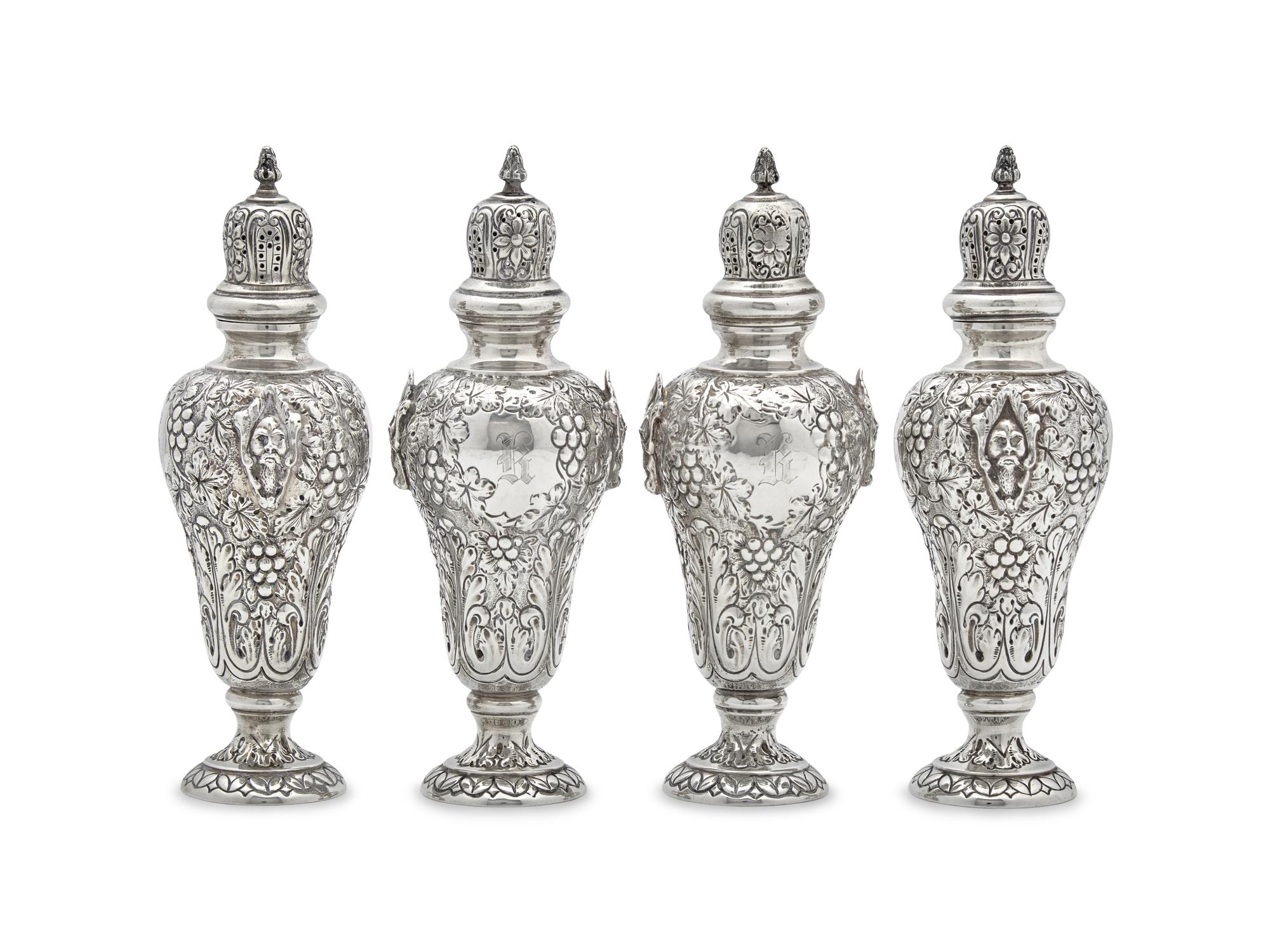 A Set of Four George V Silver Repoussé Casters