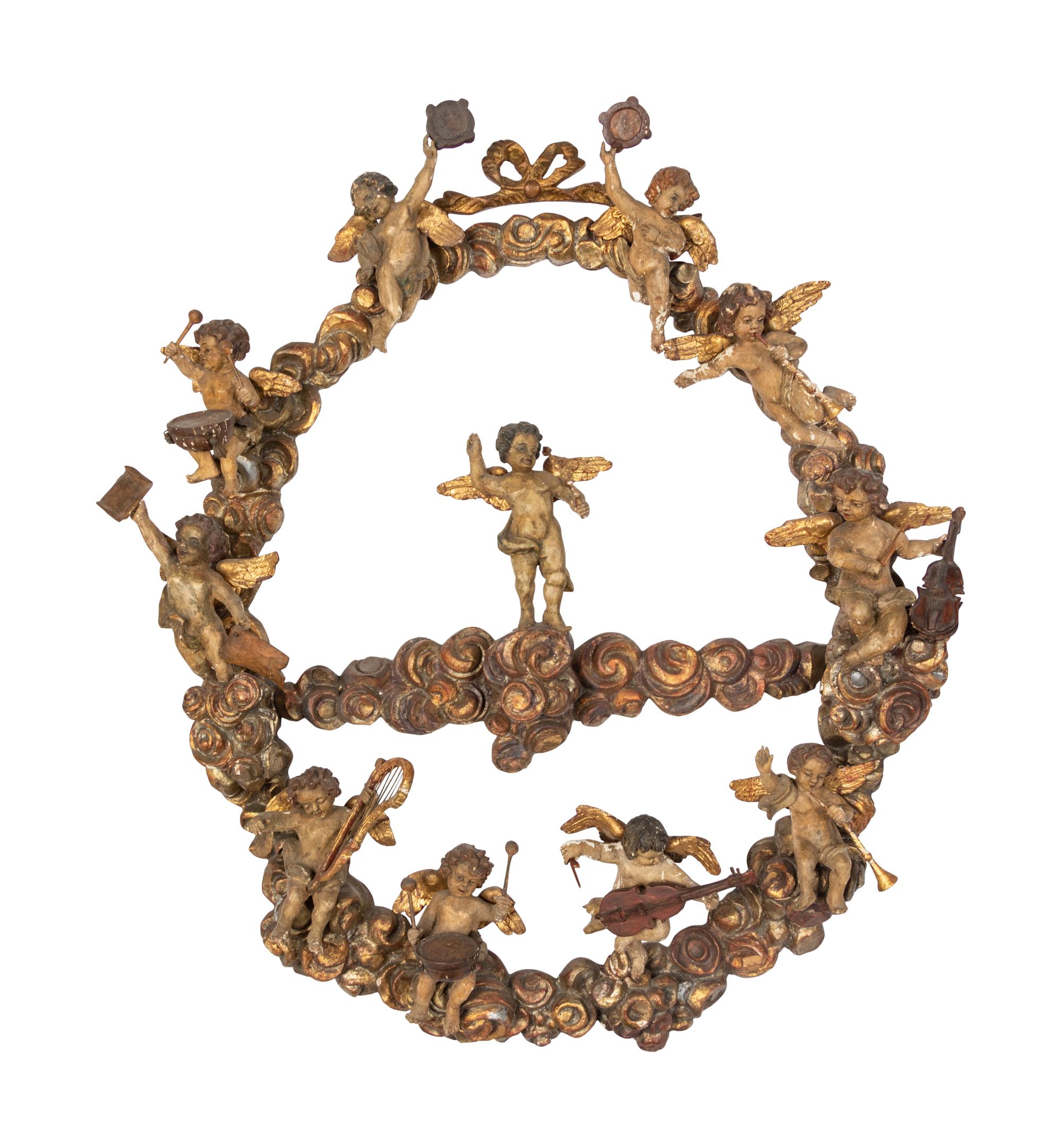 A Florentine Carved Giltwood and Silvered Wood Altarpiece with Musical Putti