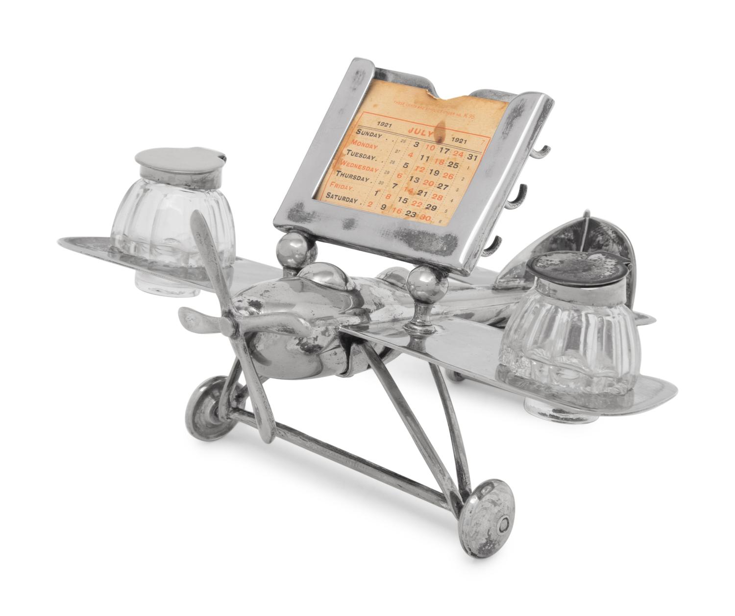 A Silver-Plate Airplane Form Ink-Well and Desk Calendar
