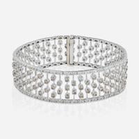 An 18K White Gold, Diamond, and Colored Diamond Bracelet