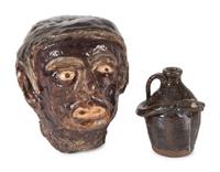 A Folk Art Glazed Stoneware Head and a Stoneware Snake Jug by Burlon B. Craig (1914-2002)