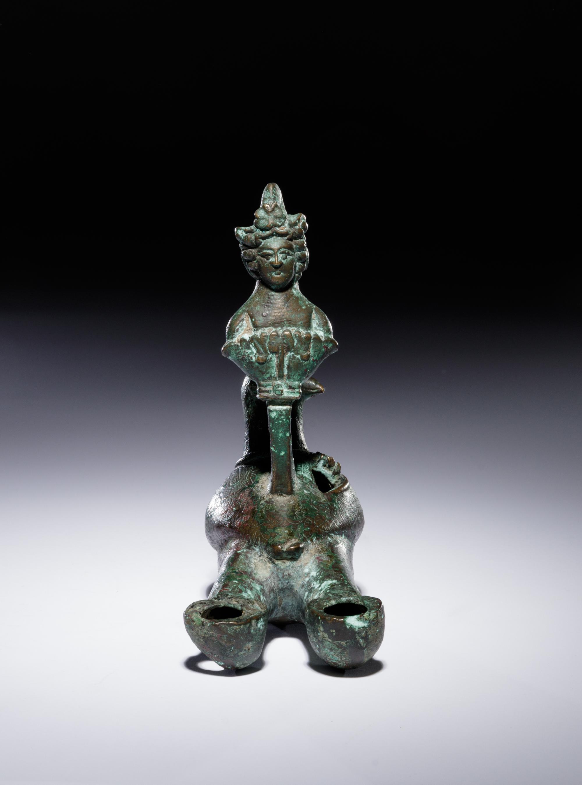 A Roman Bronze Oil Lamp in the Shape of a Dove with the Bust of a Goddess