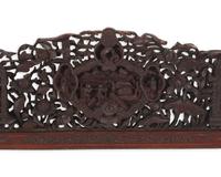A large and impressive Chinese export carved and pierced stained wood frame, 19th century