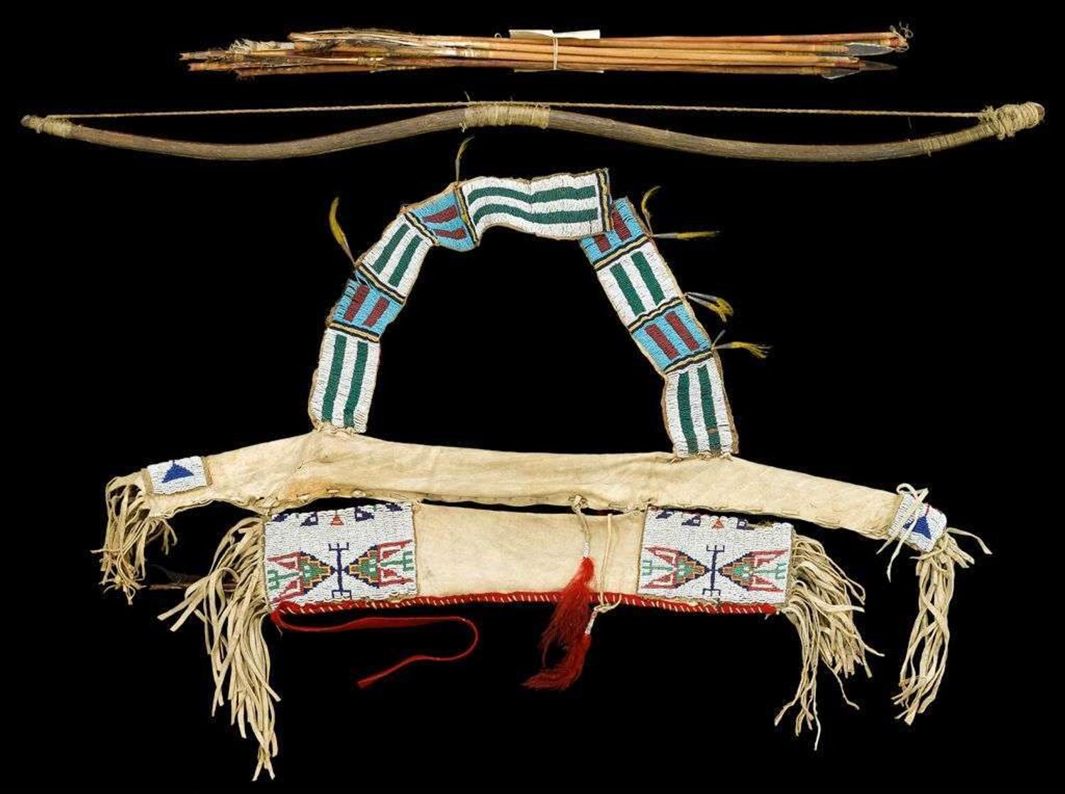 Plains beaded and fringed hide bowcase and quiver with bow and arrows early to mid 20th century