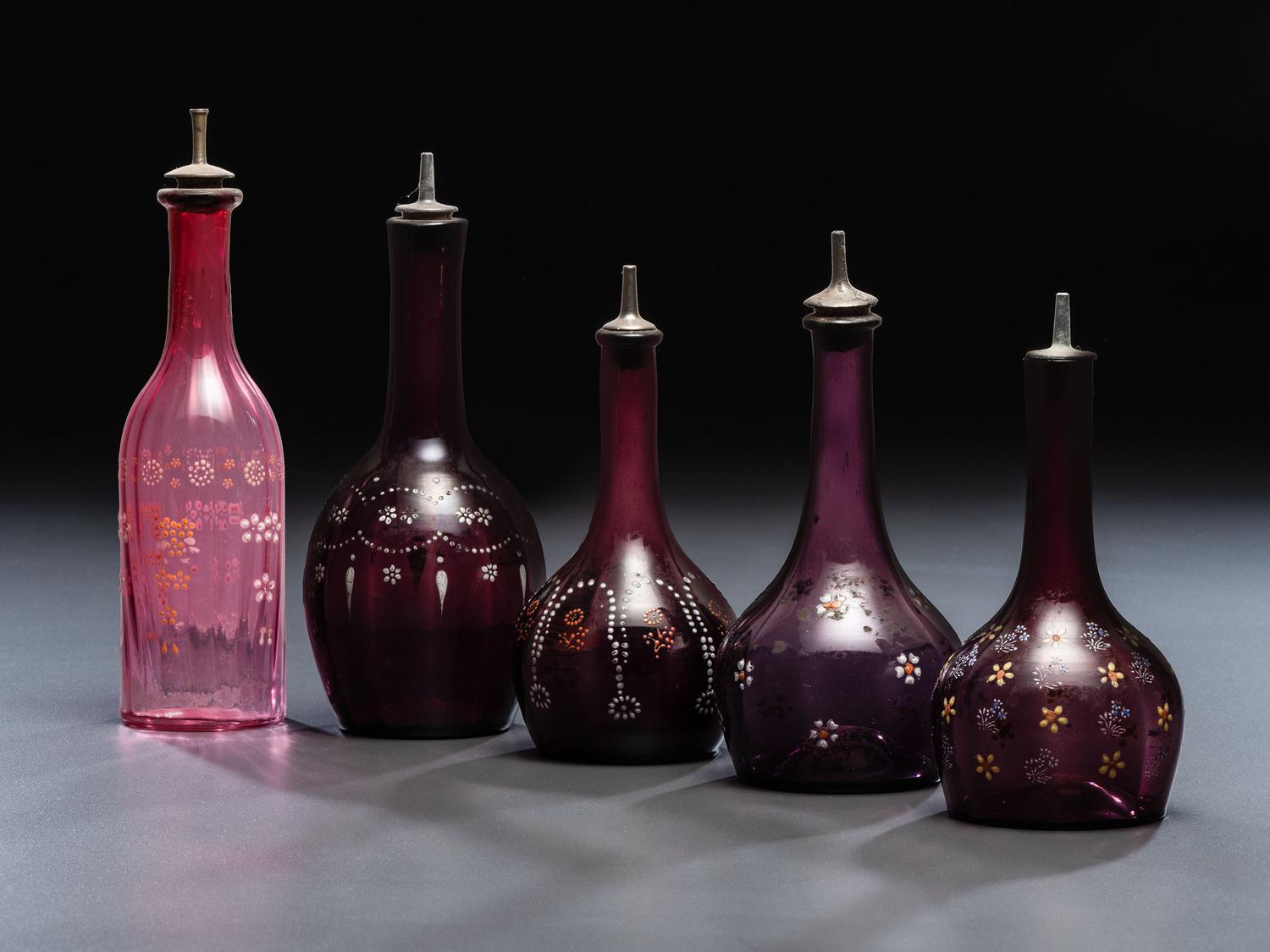 Five Enameled Glass Barber Bottles