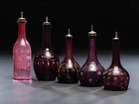 Five Enameled Glass Barber Bottles