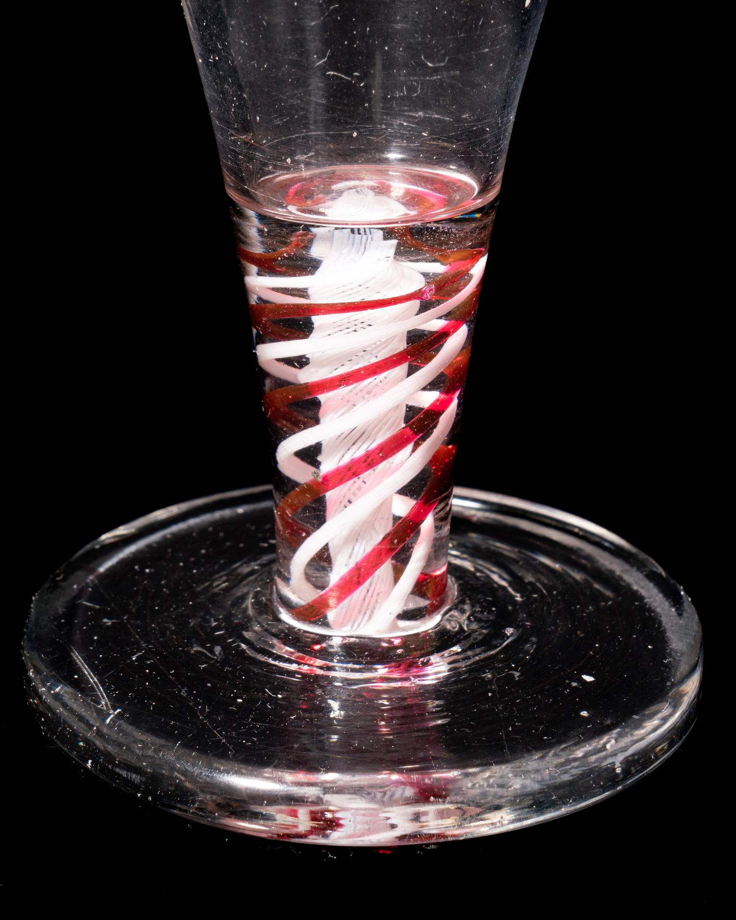A Red Color Twist Firing Glass