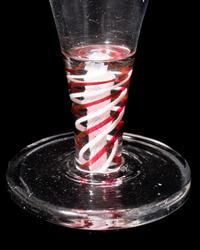 A Red Color Twist Firing Glass