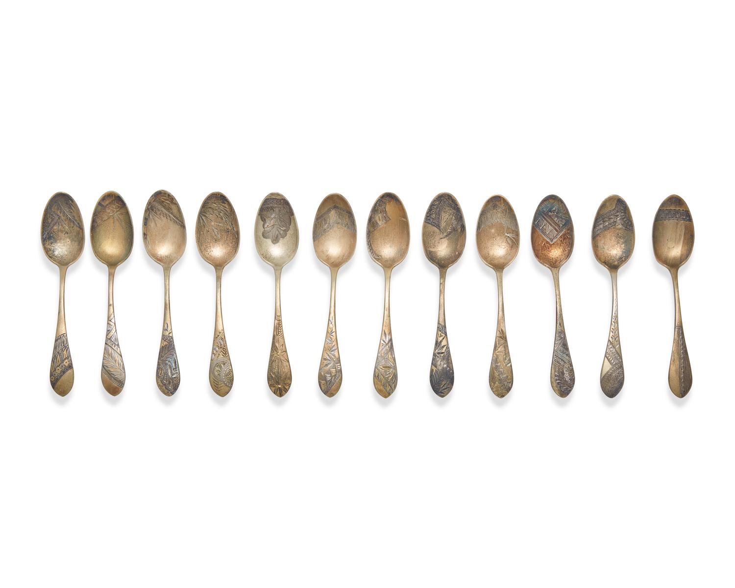 A Cased Set of Twelve Aesthetic Gilt-Washed Sterling Silver Coffee Spoons