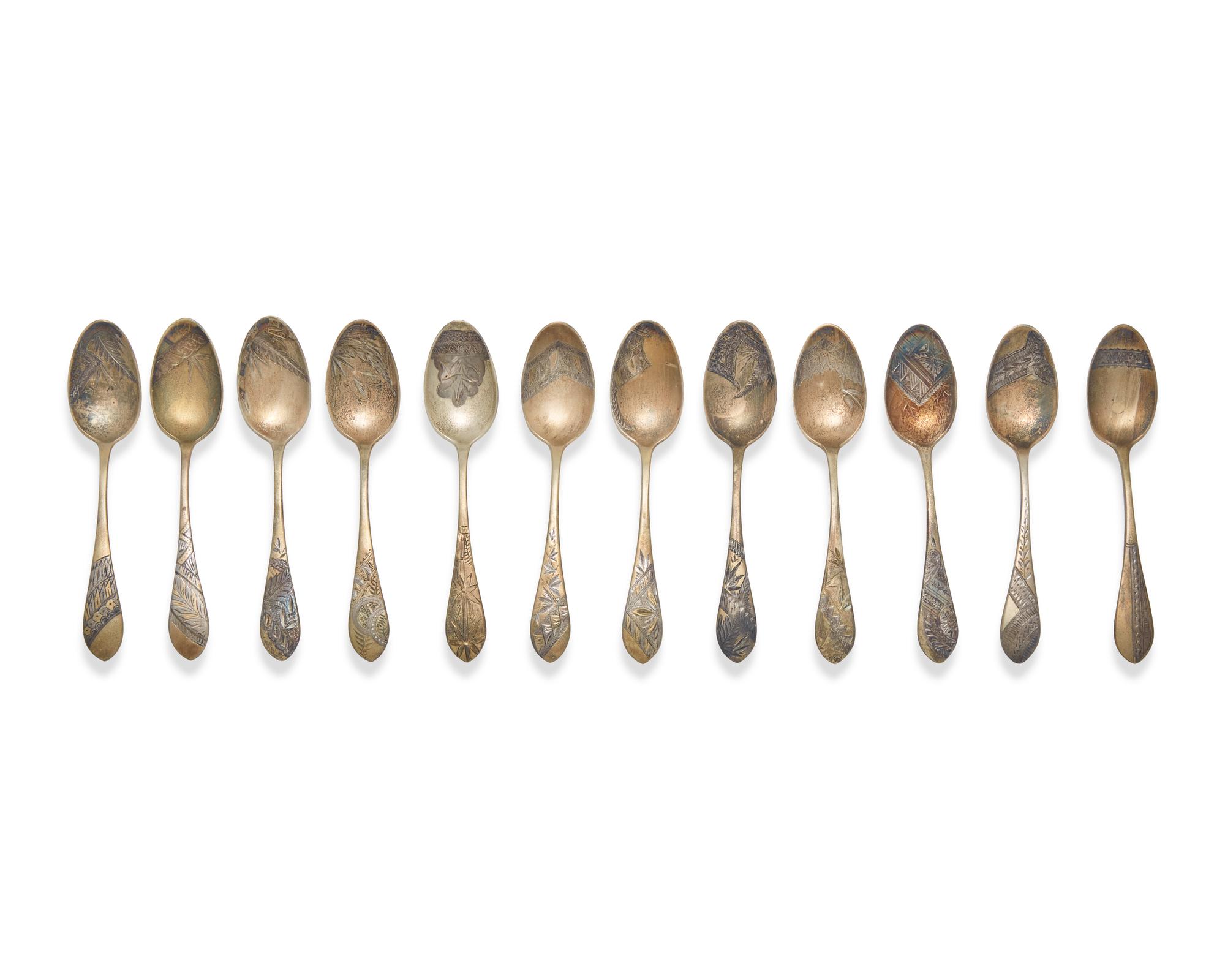 A Cased Set of Twelve Aesthetic Gilt-Washed Sterling Silver Coffee Spoons