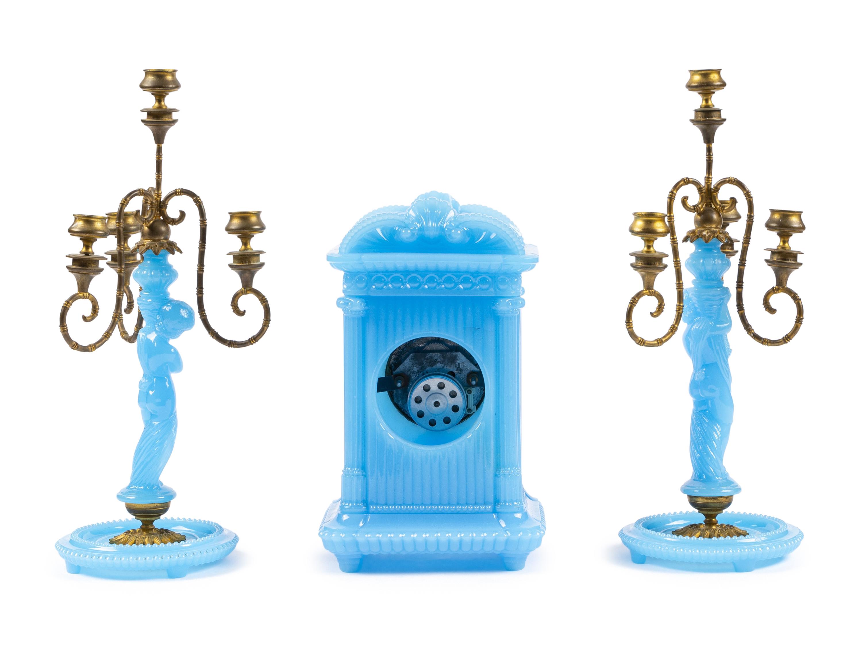 A Continental Blue Opaline Glass Three-Piece Clock Garniture