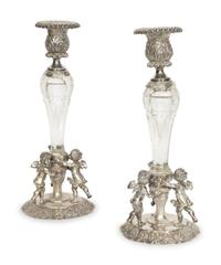 A Pair of German Silver and Cut Glass Figural Candlesticks