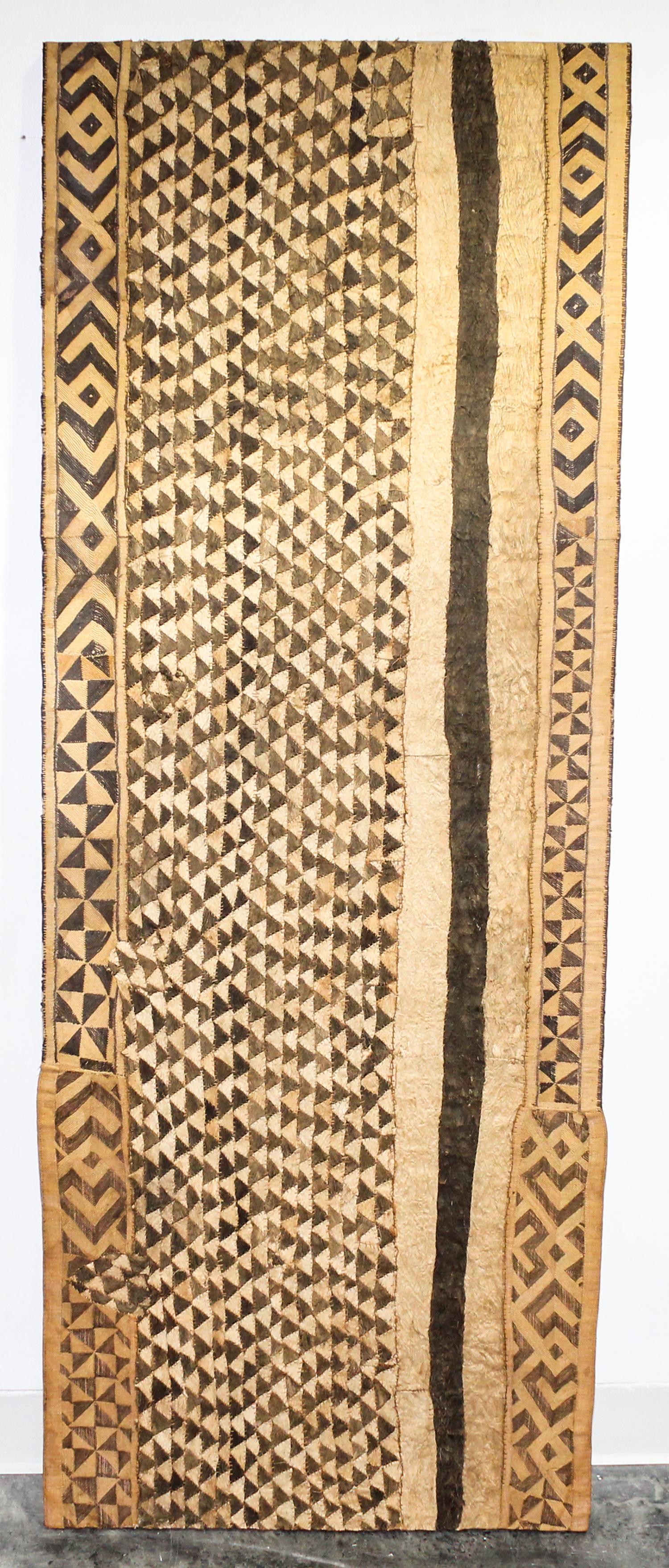 A Kuba Cloth Length 64 x width 24 inches.