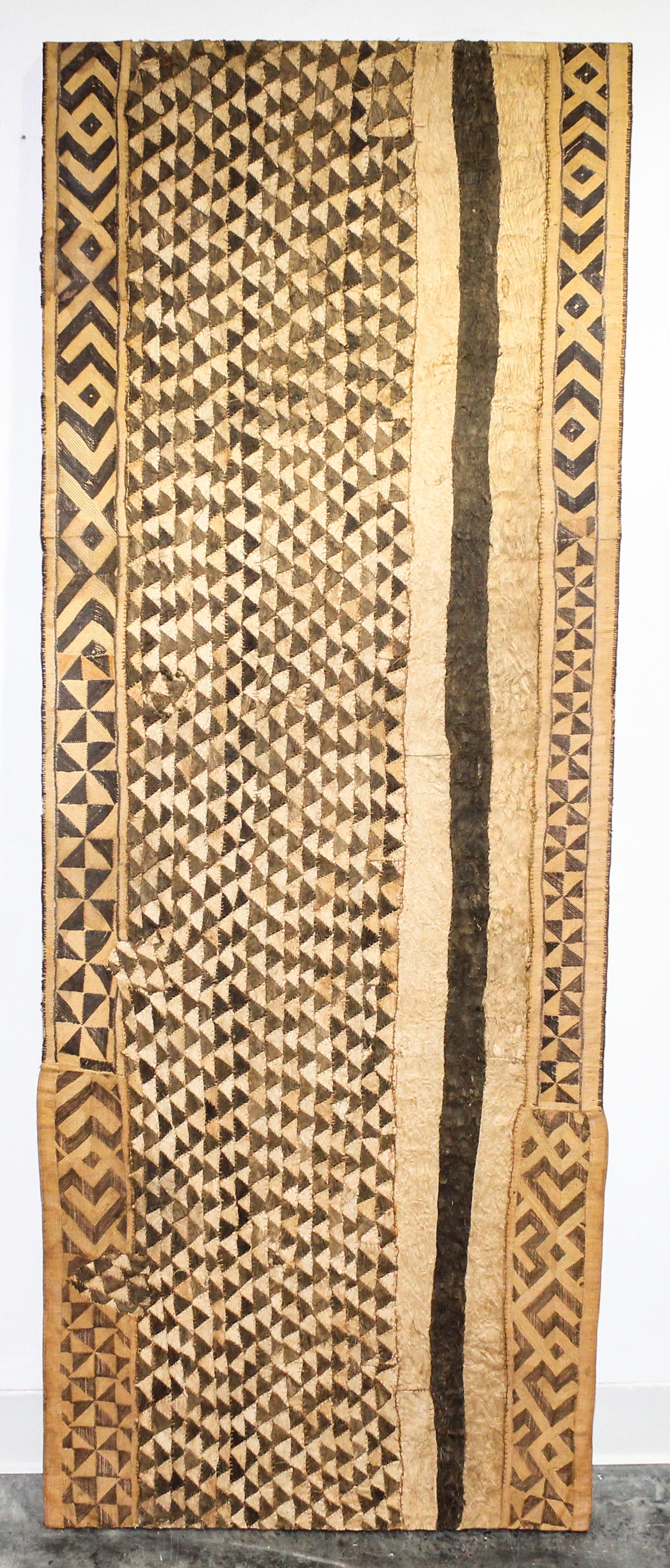 A Kuba Cloth Length 64 x width 24 inches.