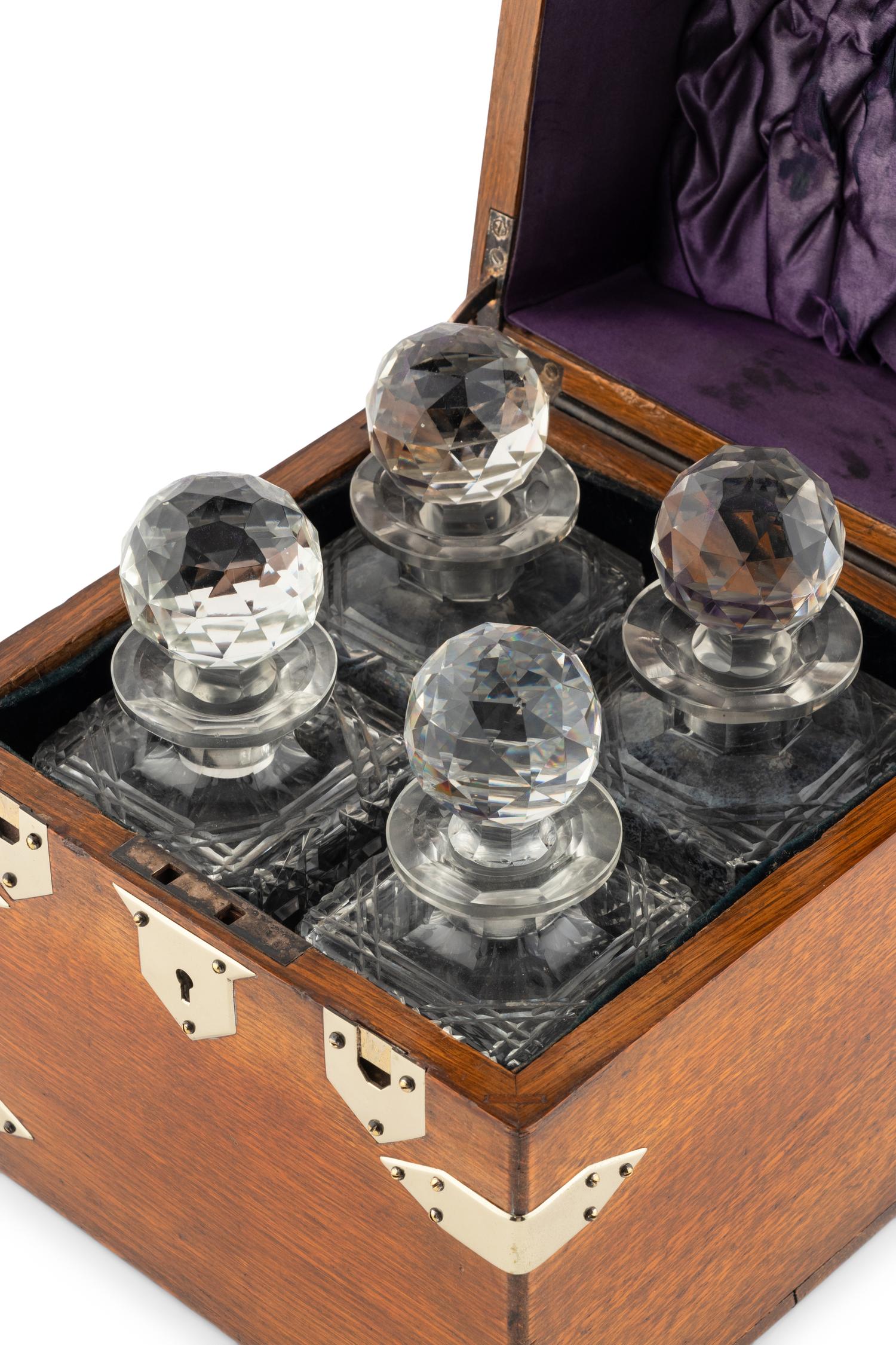 An English Mahogany Cased Four-Bottle Decanter Set