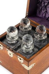 An English Mahogany Cased Four-Bottle Decanter Set