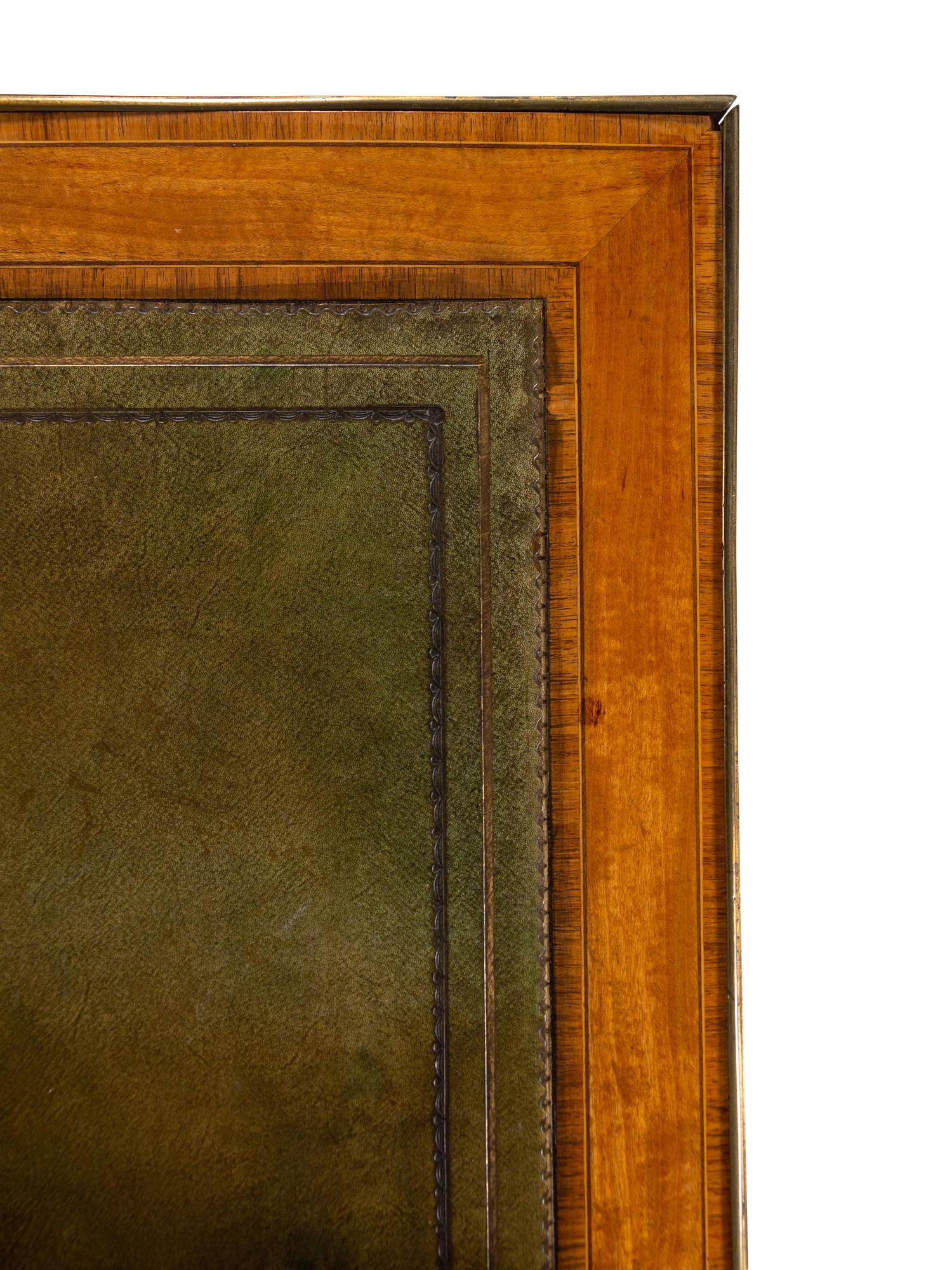 An English Gilt Bronze Mounted Satinwood Writing Table in the Louis XVI Taste
