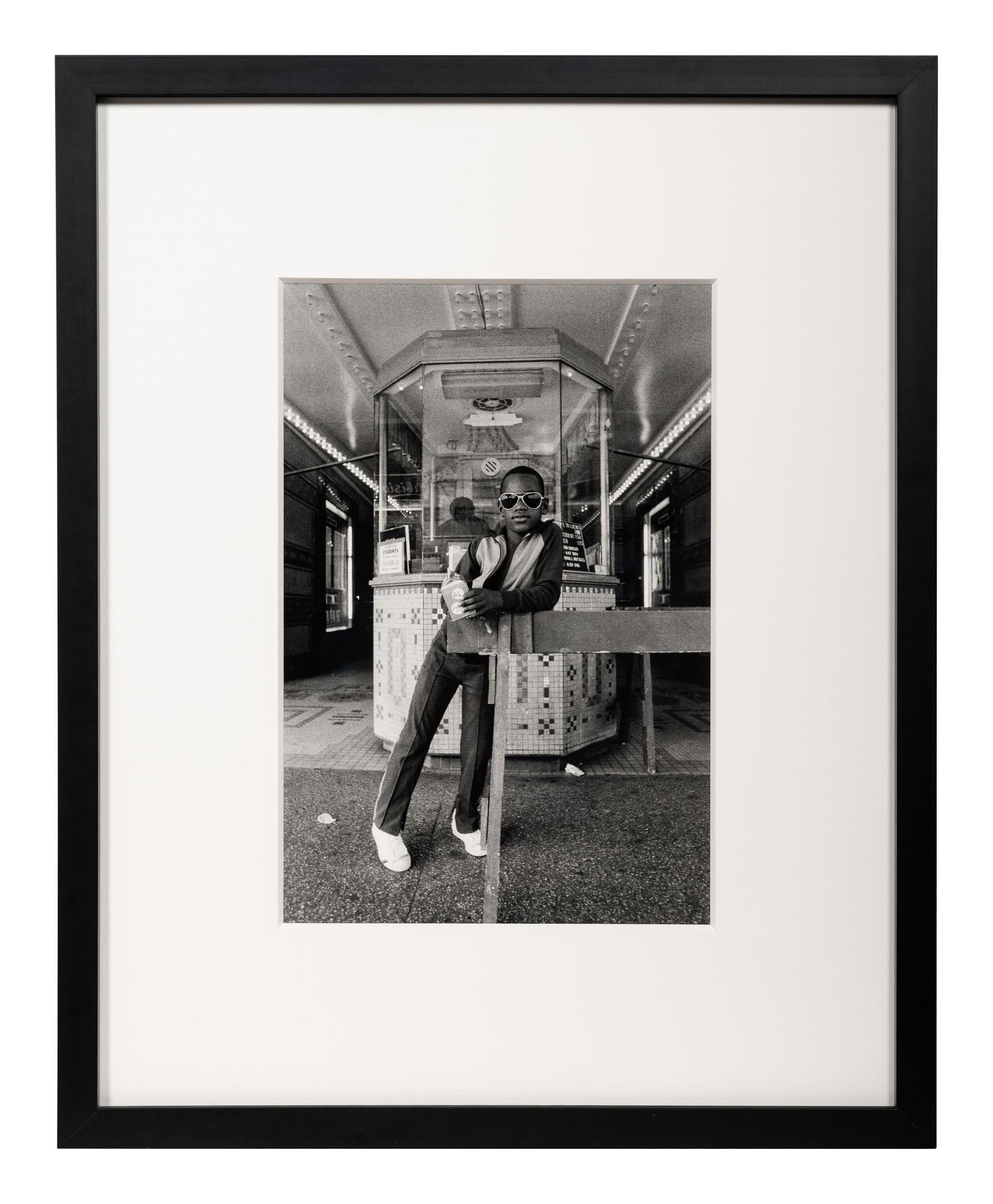 A Boy in Front of the Lowe's 125th Street Movie Theatre, 1976 (printed 2012)