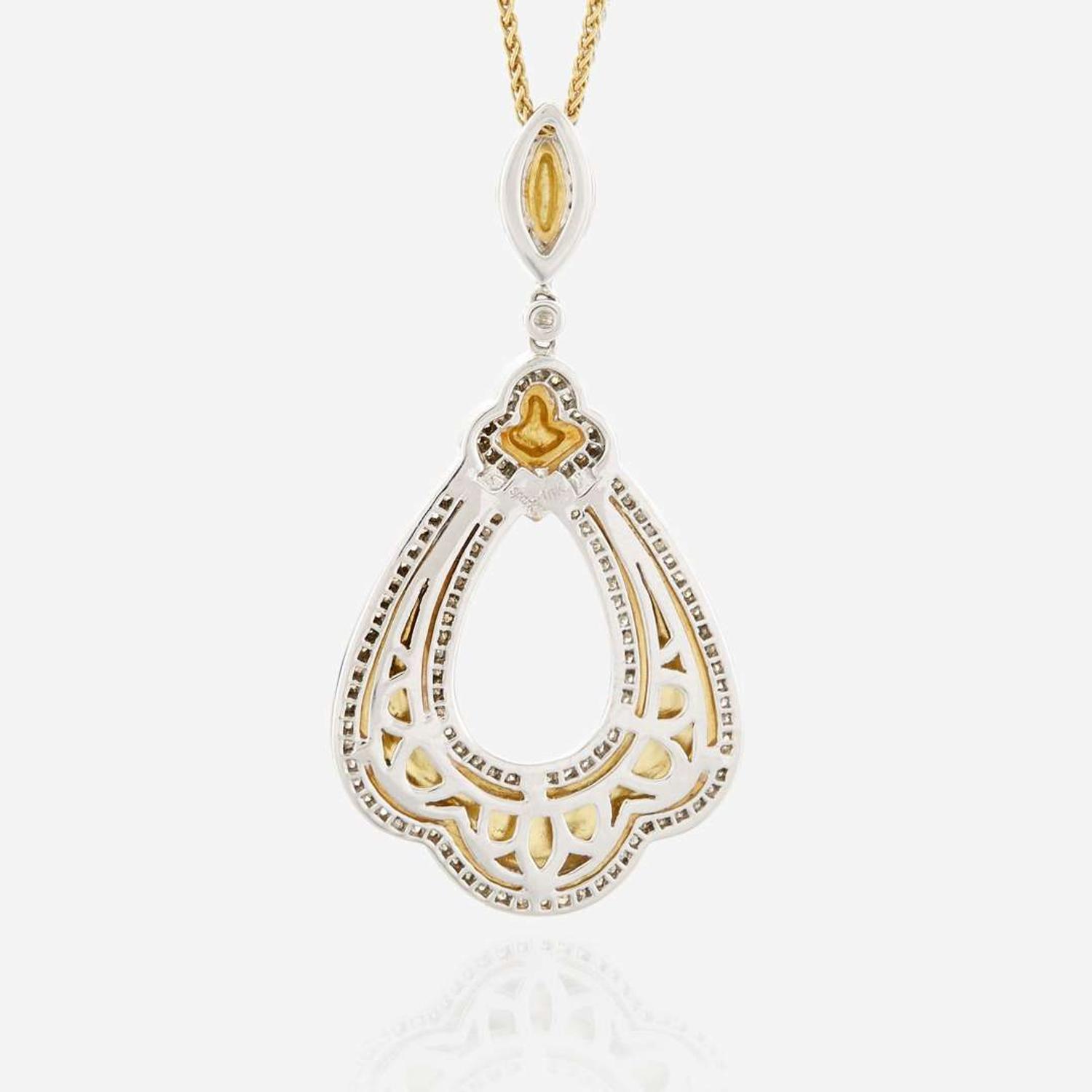 A bicolor gold and diamond pendant necklace