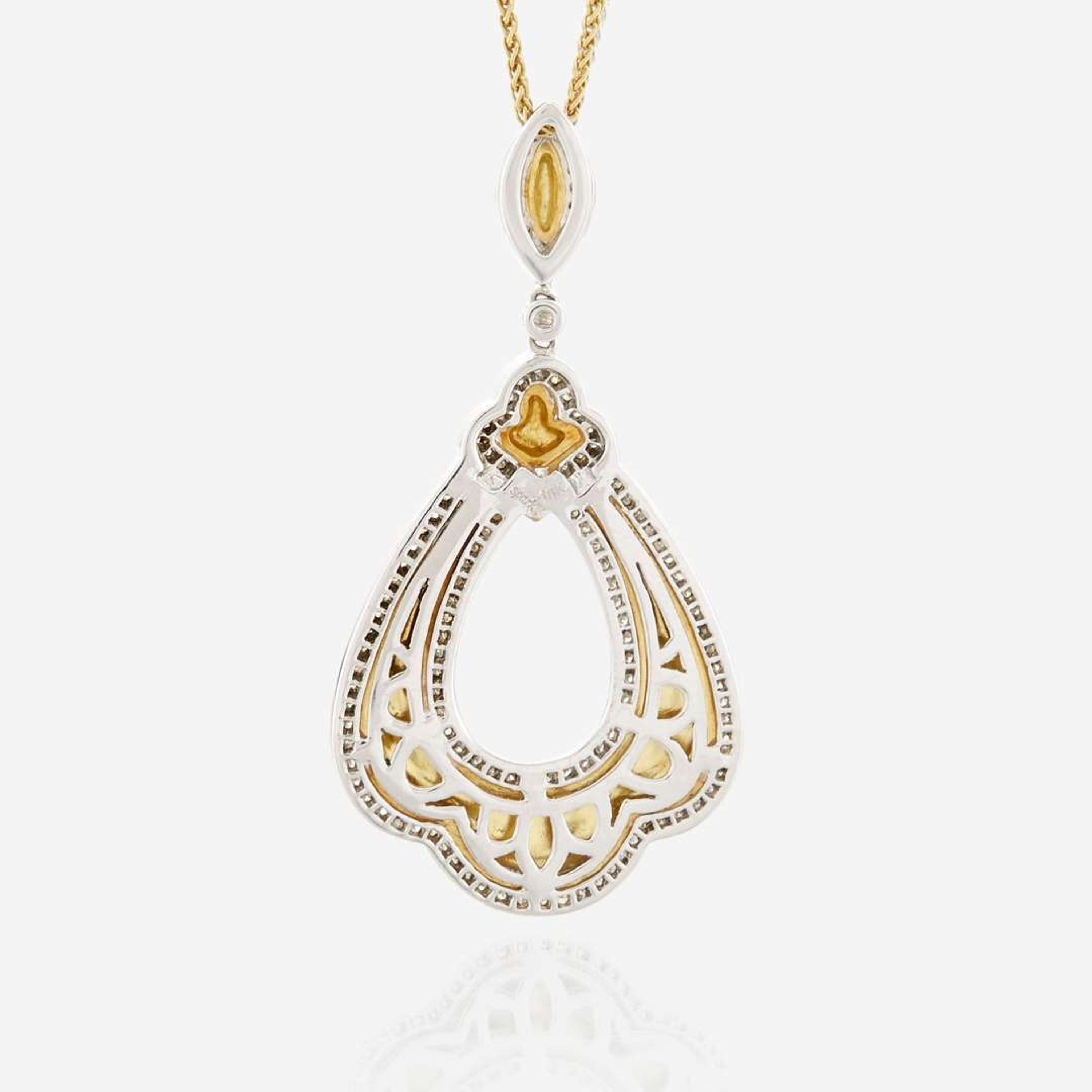 A bicolor gold and diamond pendant necklace