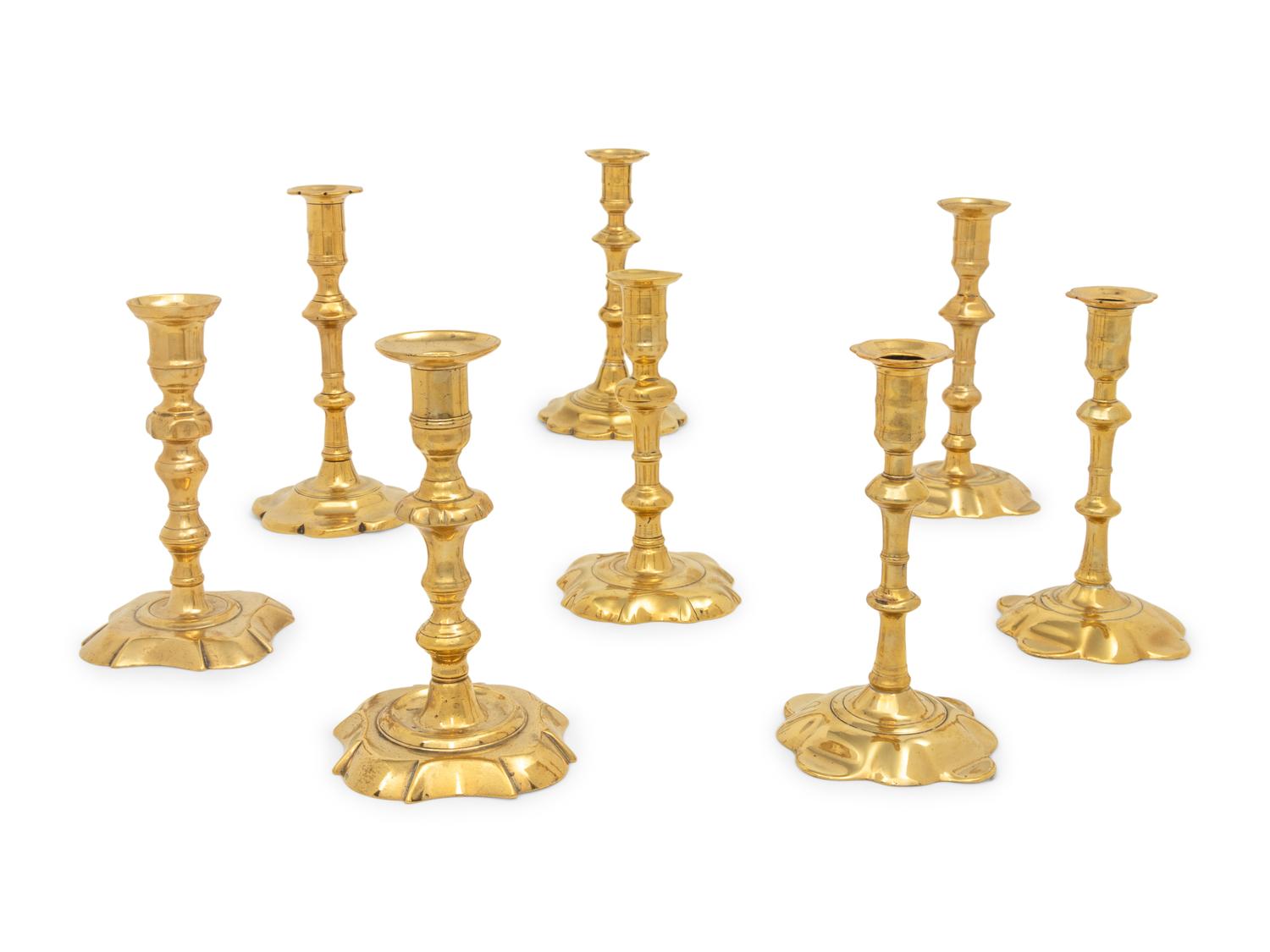 A Group of Eight English Brass Candlesticks