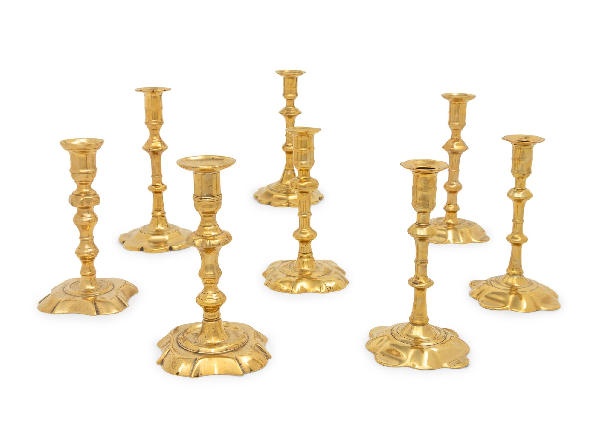 A Group of Eight English Brass Candlesticks