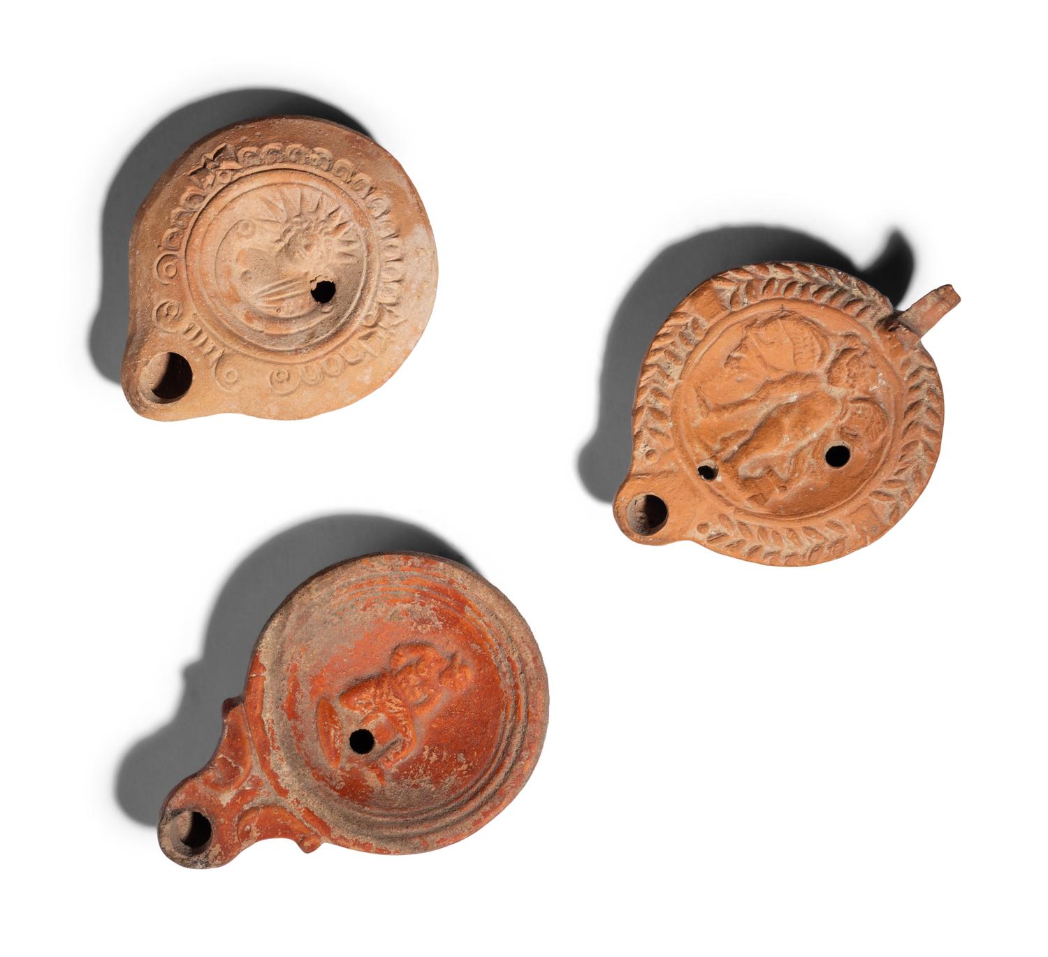 Three Roman Terracotta Oil Lamps