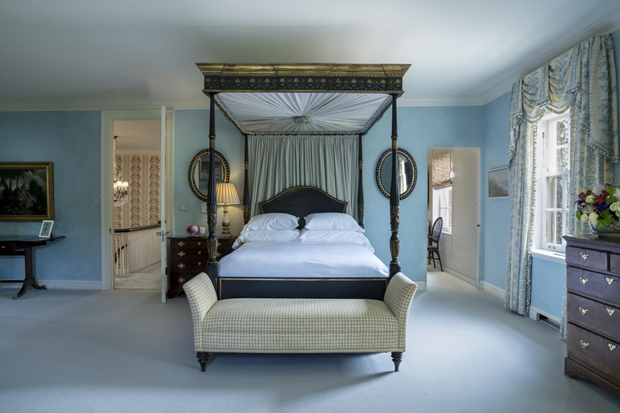 A George III Style Velvet Upholstered Camel Back Sofa