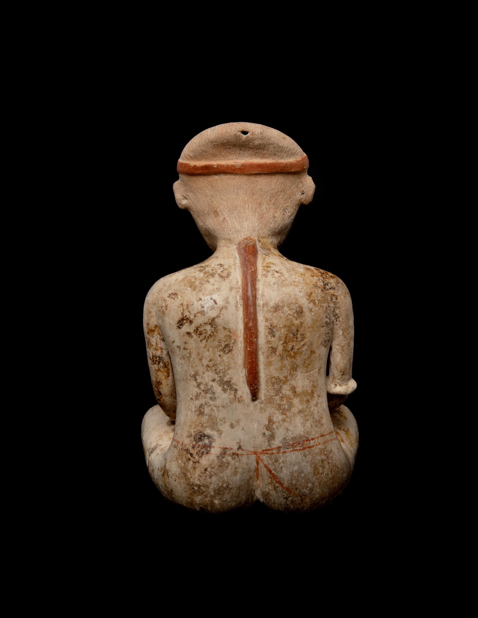 A Nayarit Pottery Seated Male Figure