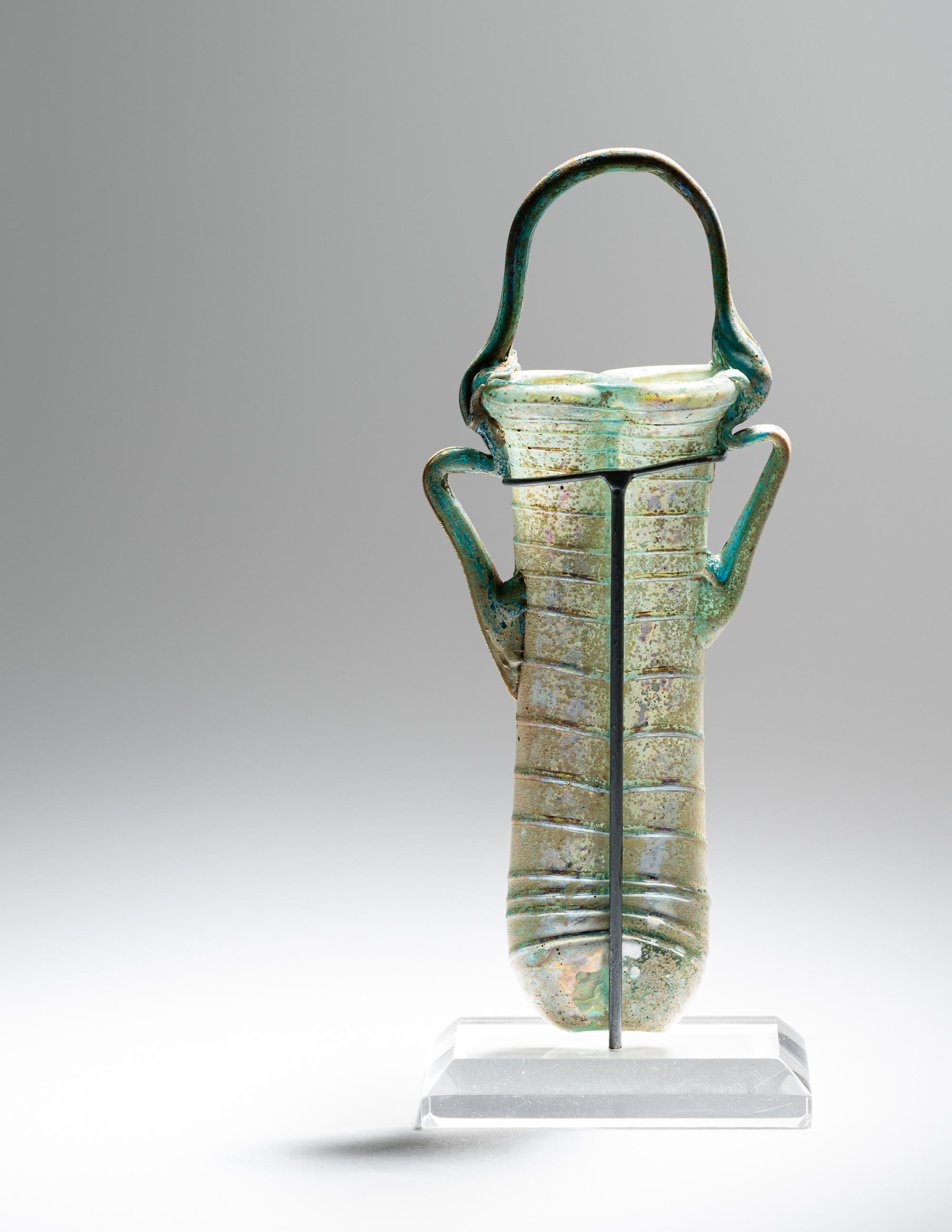 A Roman Green Glass Double Unguentarium