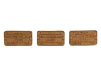 A Group of Three American Locomotive Company Metal Locomotive Badges