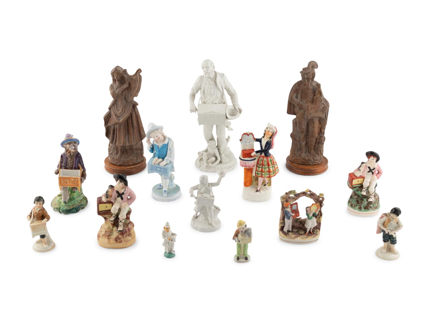 A Group of Fourteen Street Organist Figurines