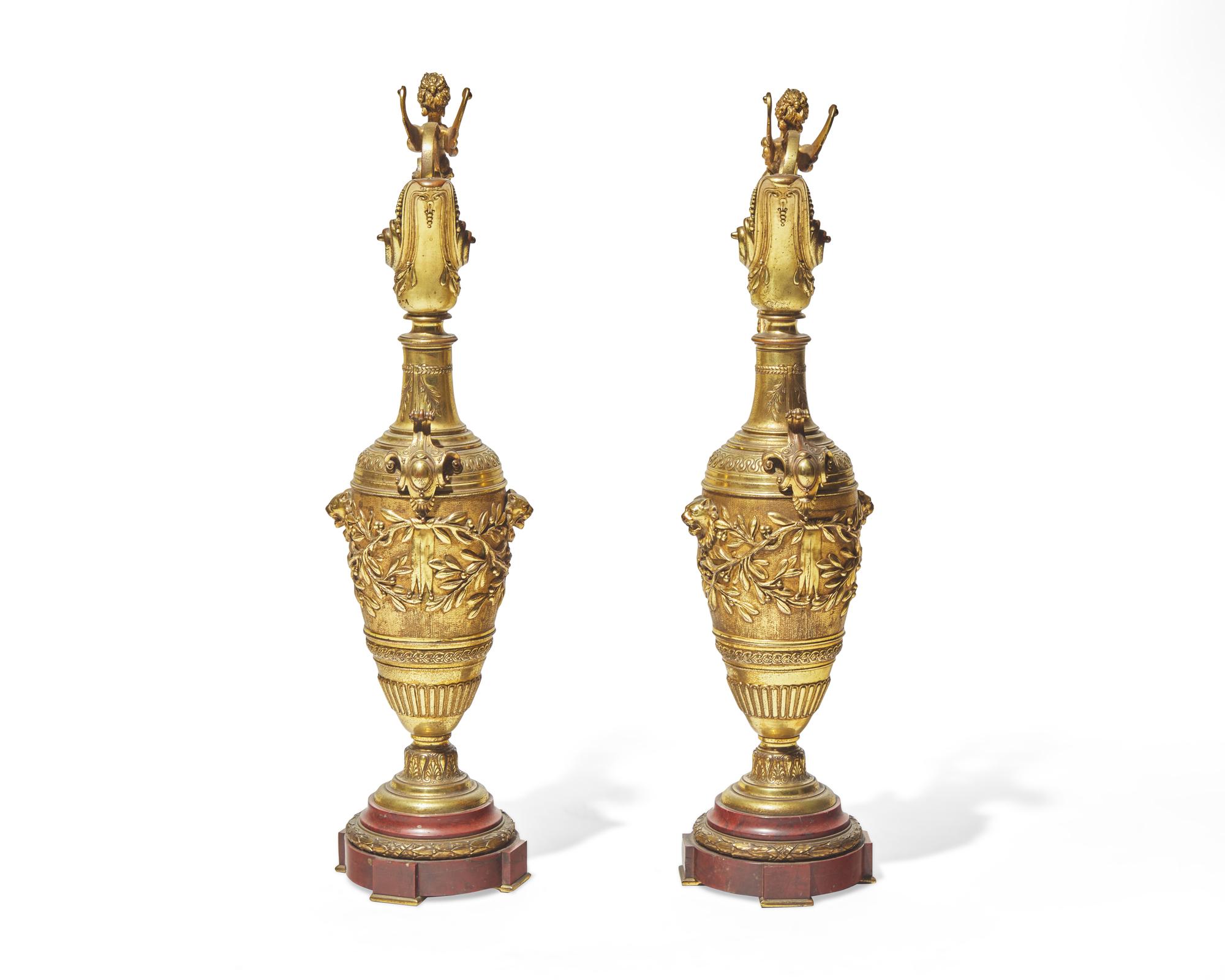 A pair of Renaissance Revival gilt bronze and rouge marble ewers, late 19th century