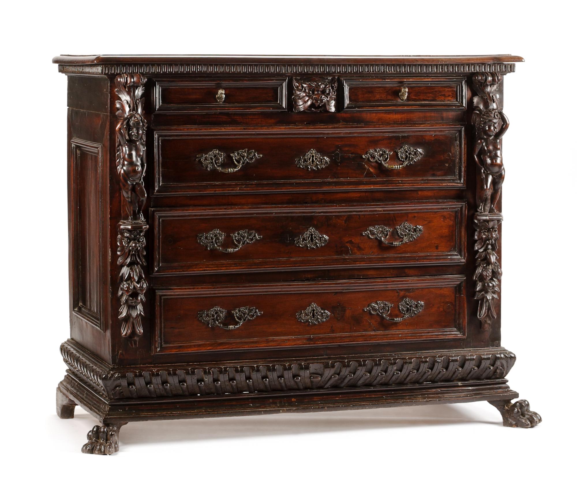 An Italian Renaissance Style Carved Chest of Drawers Height 46 x width 53 1/2 x depth 25 3/8 inches. — 17TH CENTURY AND LATER