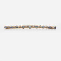 A 14K Yellow Gold, Diamond, and Sapphire Brooch