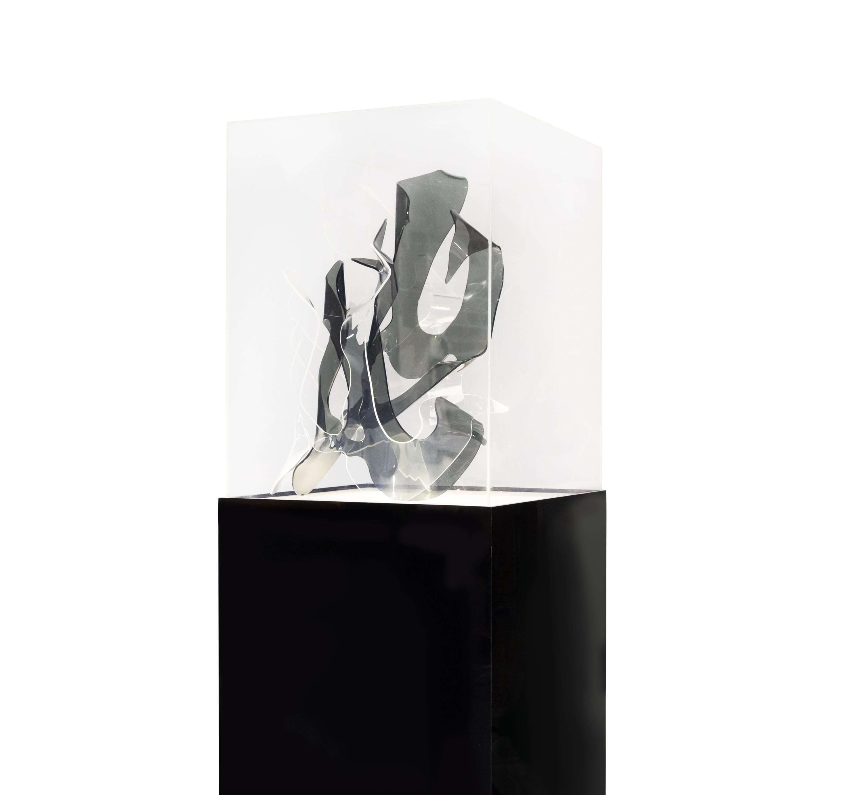 Sculpture and Lighted Pedestal