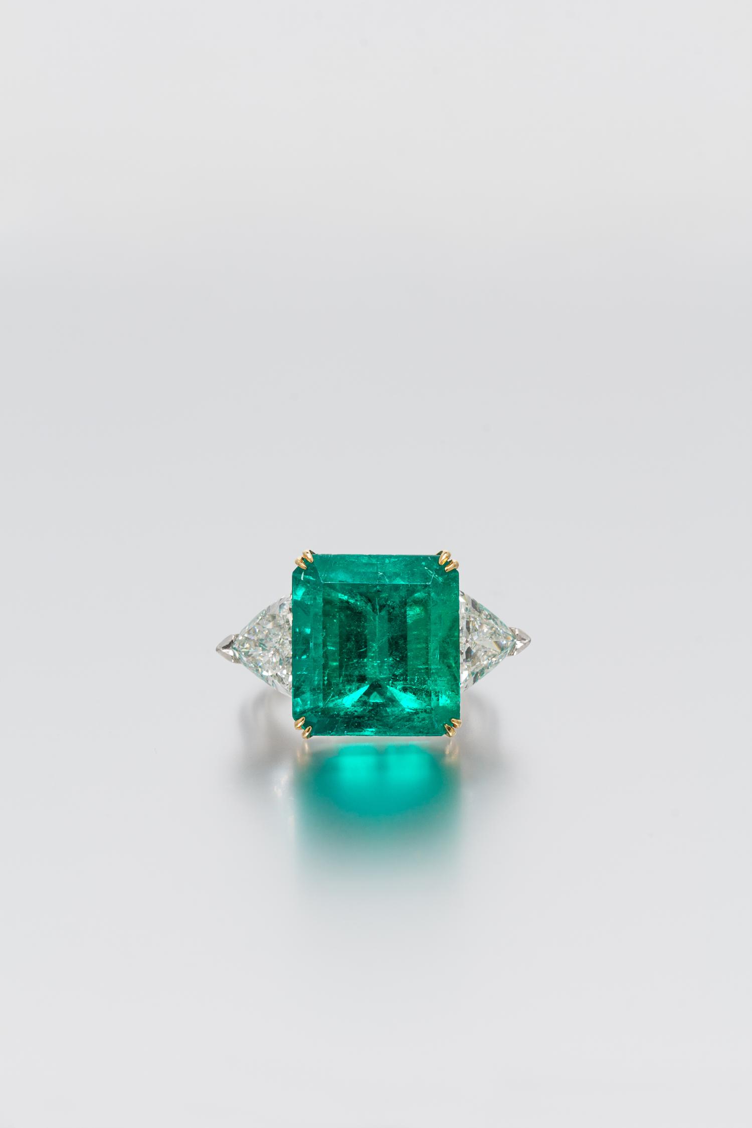 A Platinum, 18 Karat Yellow Gold, Emerald and Diamond Ring, Harry Winston, 6.20 dwts.