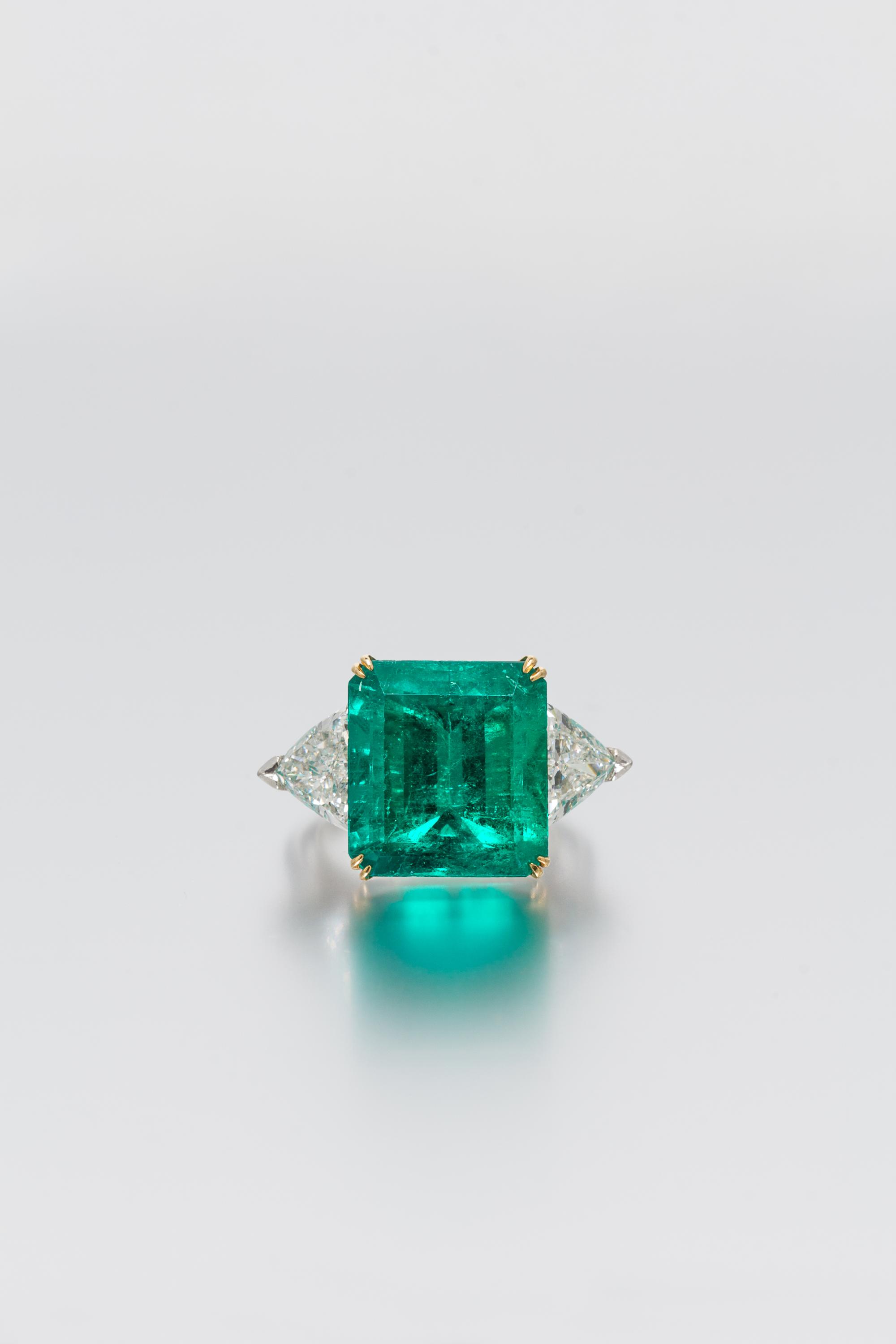 A Platinum, 18 Karat Yellow Gold, Emerald and Diamond Ring, Harry Winston, 6.20 dwts.