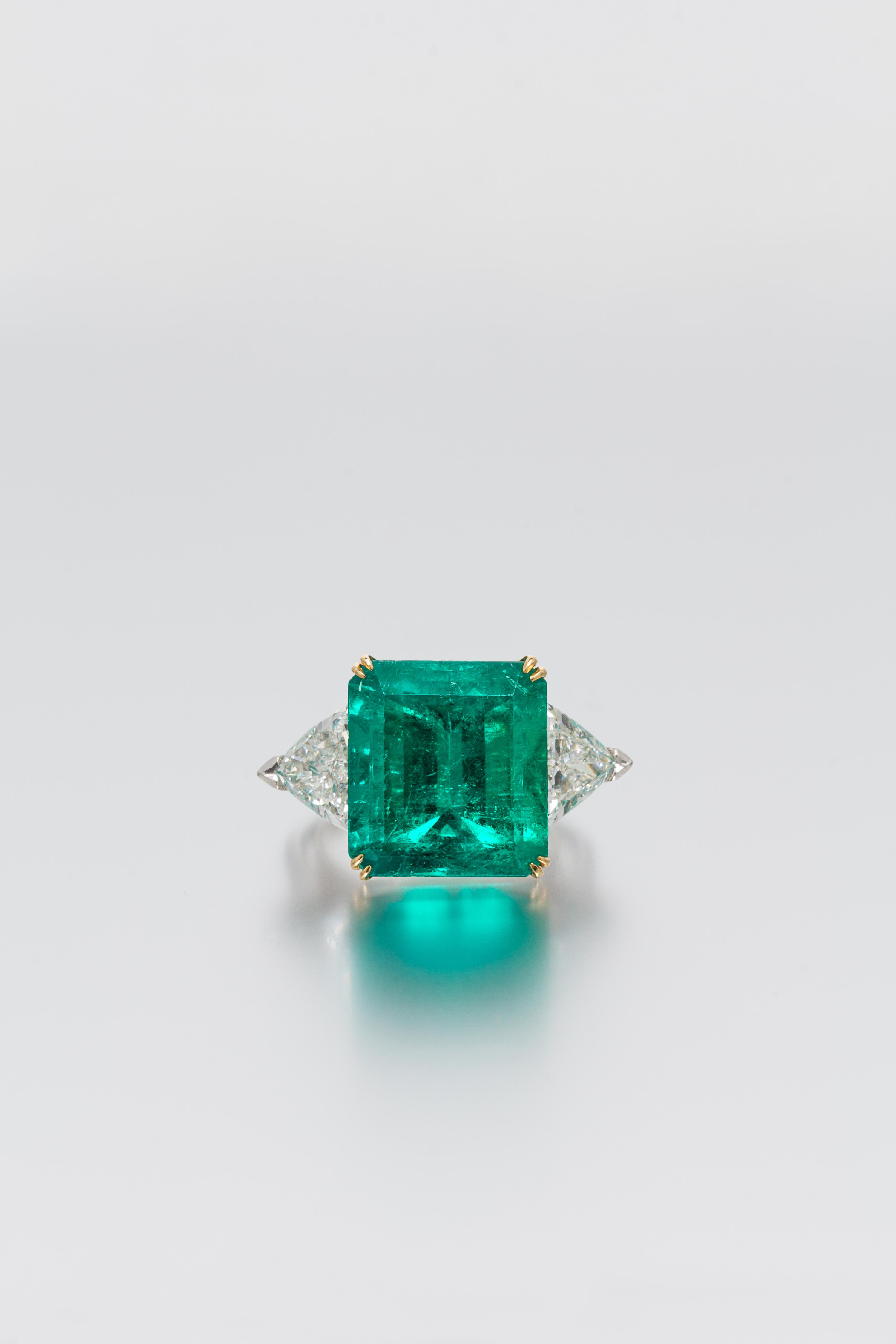 A Platinum, 18 Karat Yellow Gold, Emerald and Diamond Ring, Harry Winston, 6.20 dwts.