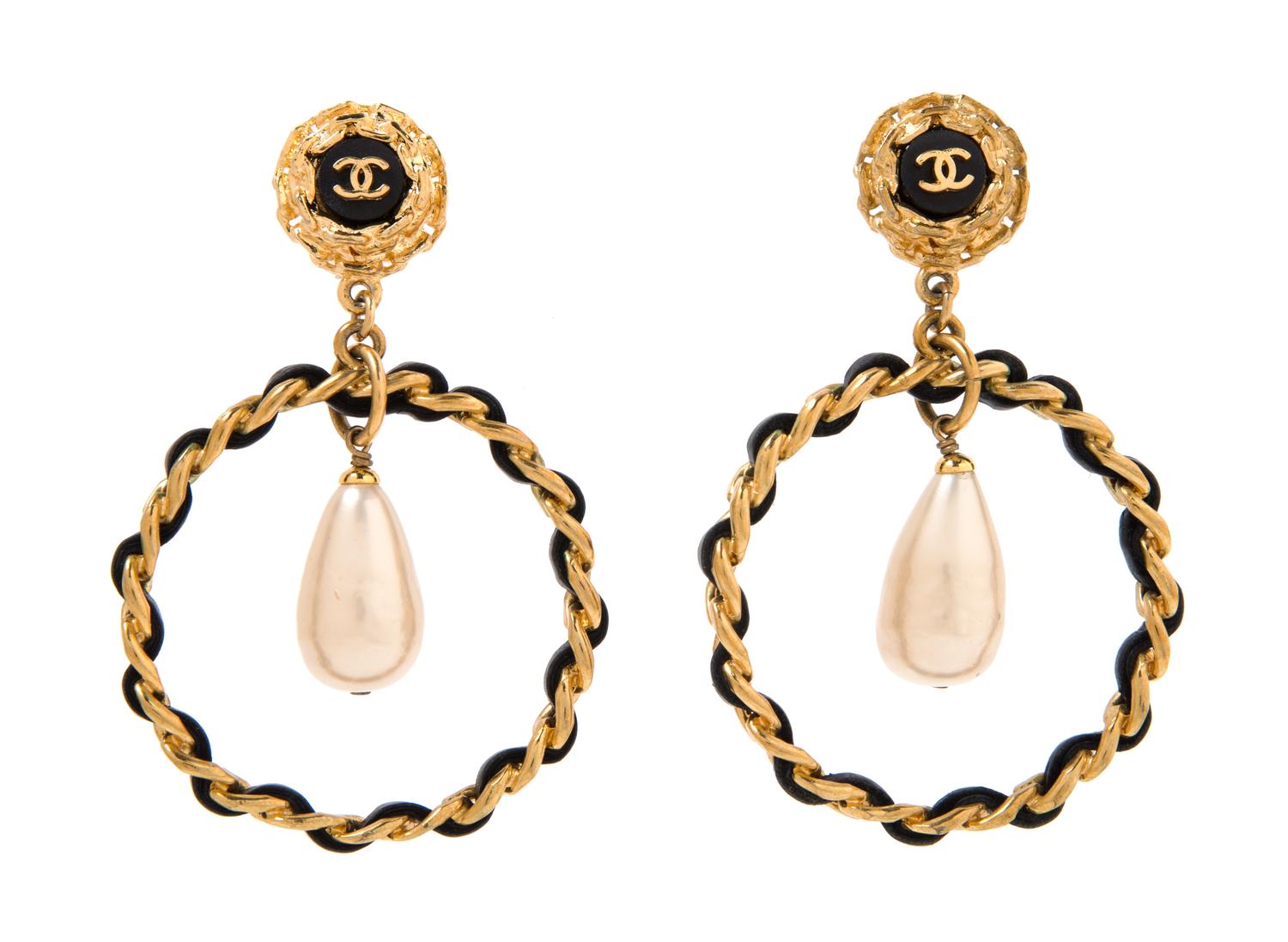 A Pair of Chanel Goldtone and Black Leather Hoop Earclips, 3.25" x 2".