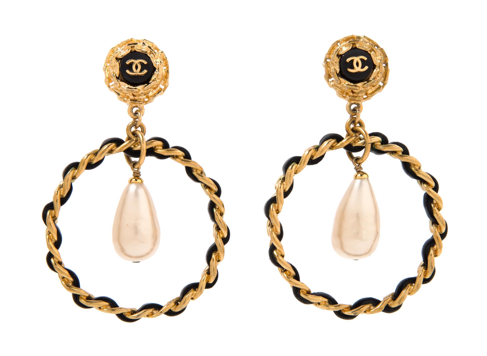 A Pair of Chanel Goldtone and Black Leather Hoop Earclips, 3.25" x 2".