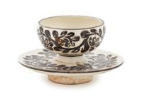 A Cizhou Tea Cup and Stand Total high 2 1/2 inches.