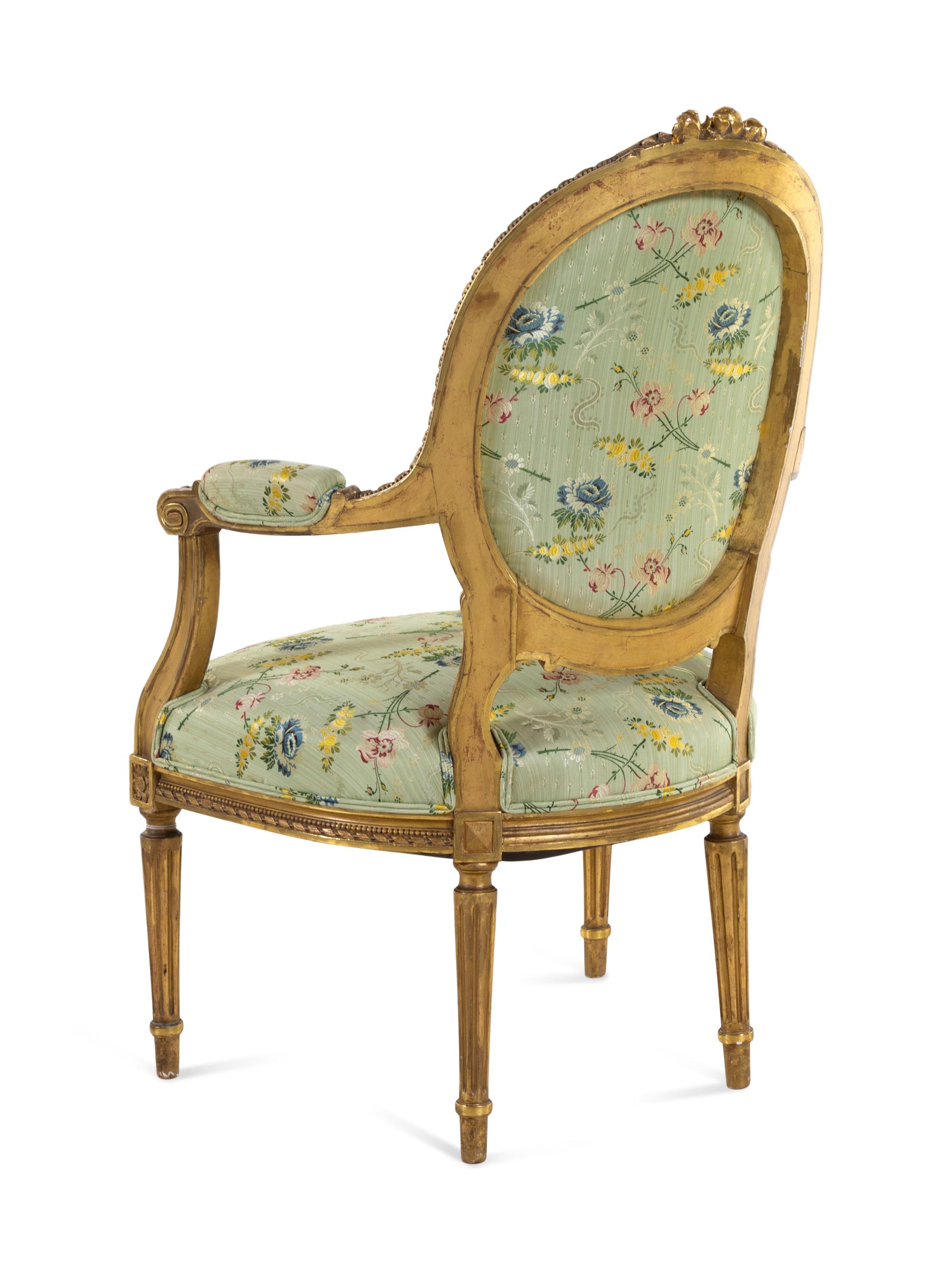 A Set of Four Louis XVI Style Carved Giltwood Fauteuils