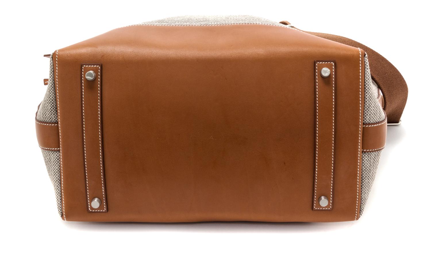 An Hermes Ecru Canvas and Fawn Barenia Calfskin Caleche-Express Medium Tote, 15.3" 14.1" 7.8".