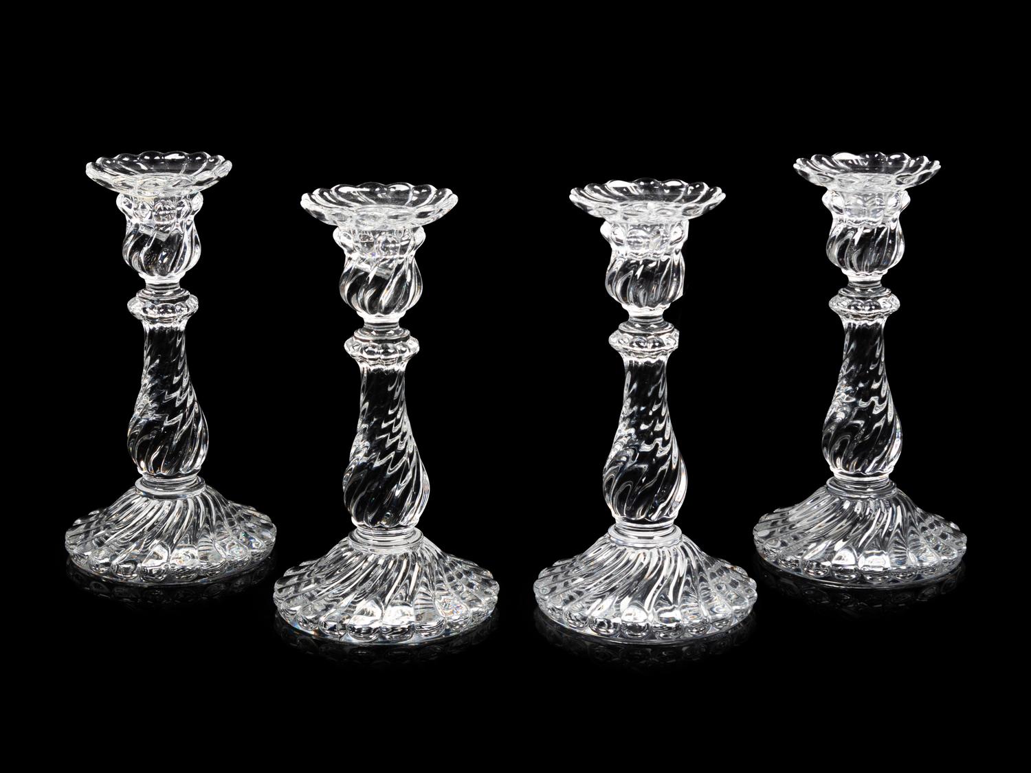 A Set of Four Molded Glass Candlesticks